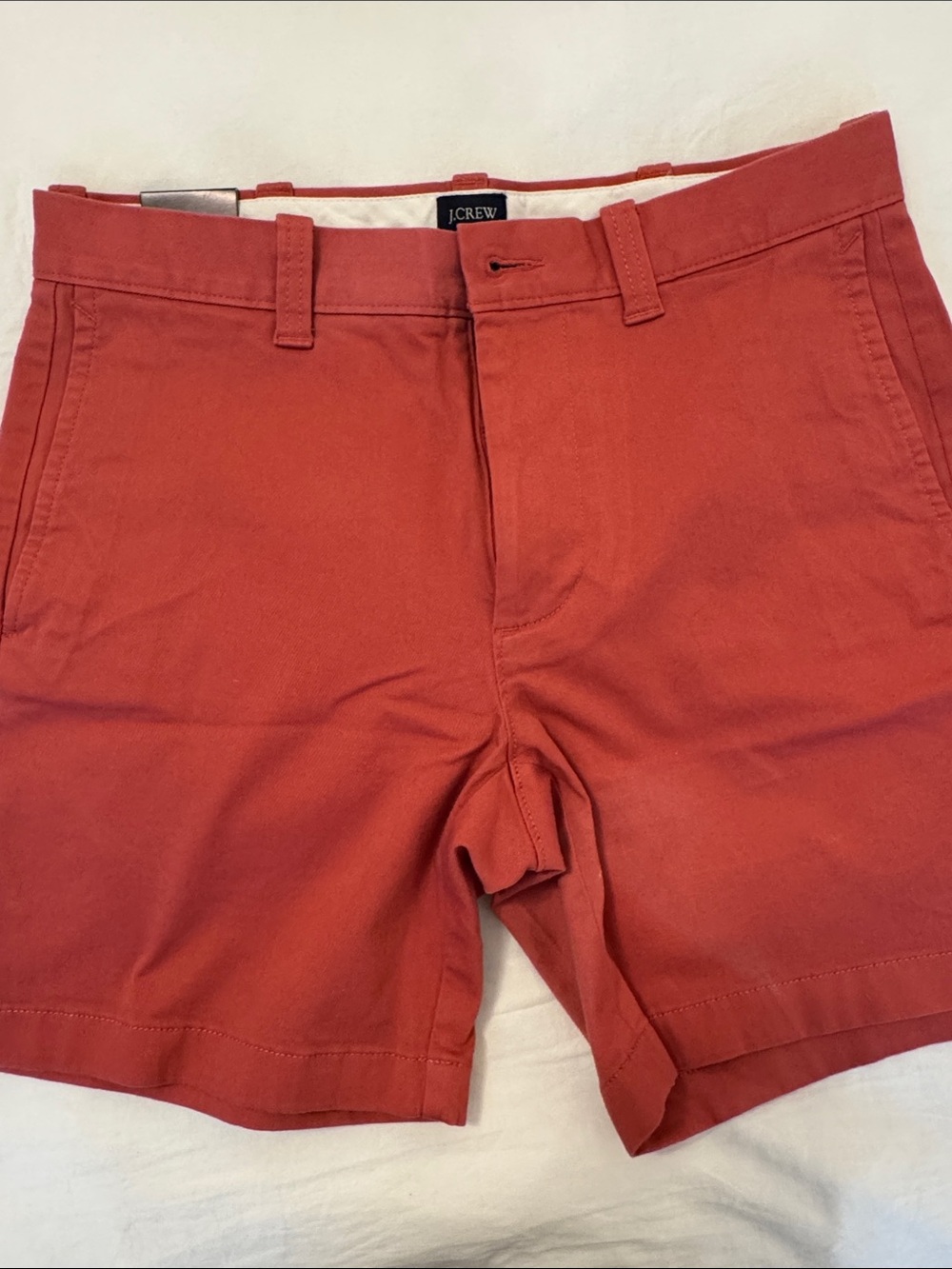 J. Crew Men's  saltwater red Flat-Front Chino Shorts
29 waist 
7" inseam 
New